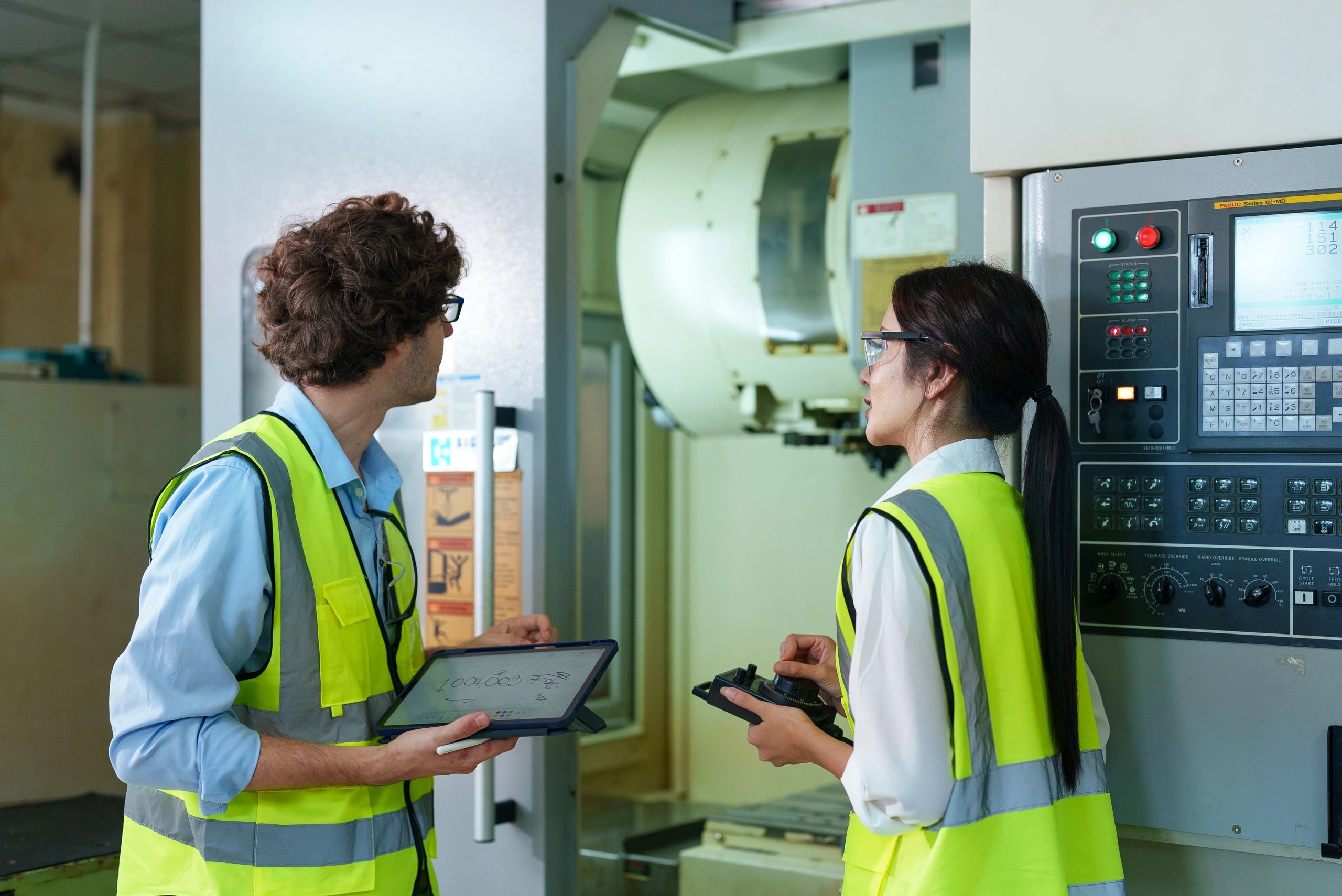 Engineer using tablet in a manufacturing setting